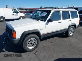 1996 Jeep Cherokee Sport with VIN 1J4FJ68S9TL234764, listed as a IAAI auction lot 41636731 with 129,732 mi miles. Bid and sale history available at carsss.com. Image 2.
