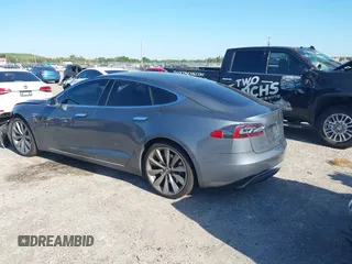 2014 Tesla Model S 60 with VIN 5YJSA1H1XEFP31911, listed as a IAAI auction lot 42029215 with Not Provided miles and . Bid and sale history available at DreamBid. Image 3.