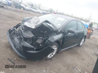 2023 Toyota Corolla LE with VIN 5YFB4MDE1PP058774, listed as a IAAI auction lot 42068978 with 19,802 mi miles and . Bid and sale history available at DreamBid. Image 2.