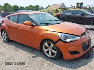 2012 Hyundai Veloster w/Gray Int z VIN KMHTC6AD0CU043402, wystawiony jako IAAI lot #42406321 z przebiegiem 116 734 mil mil oraz . Historia ofert i sprzedaży dostępna na DreamBid. Obrazek 1.
