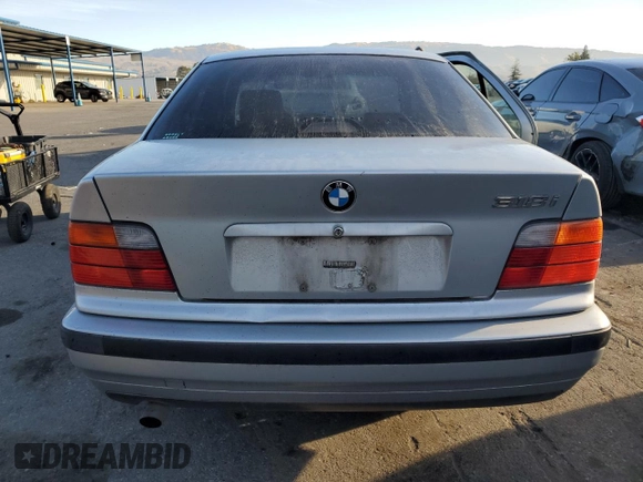 1997 BMW 3 Series 318i with VIN WBACC9328VEE57445, listed as a Copart auction lot 84380934 with 0 mi miles and Salvage Title. Bid and sale history available at carsss.com. Image 6.
