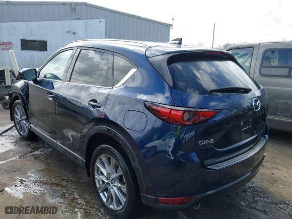2021 Mazda CX-5 Grand Touring with VIN JM3KFADM1M1356538, listed as a IAAI auction lot 41723485 with 91,925 mi miles. Bid and sale history available at carsss.com. Image 3.