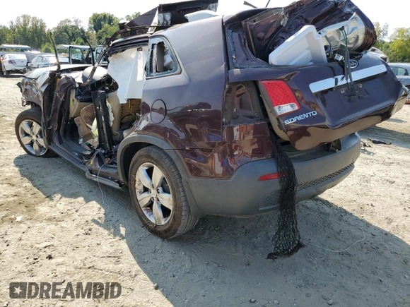 2012 Kia Sorento EX with VIN 5XYKU4A62CG222061, listed as a Copart auction lot 71044124 with 218,770 mi miles and Salvage Title. Bid and sale history available at carsss.com. Image 2.