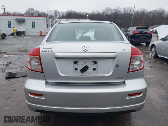 2011 Suzuki SX4 z VIN JS2YC5A41B6300385, wystawiony jako IAAI lot #41570810 z przebiegiem 117 847 mil mil oraz . Historia ofert i sprzedaży dostępna na DreamBid. Obrazek 16.