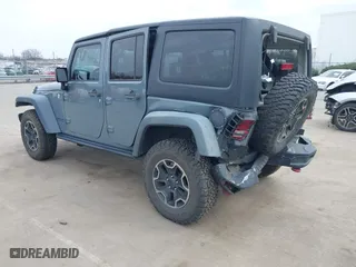 2015 Jeep Wrangler Unlimited Rubicon Hard Rock with VIN 1C4HJWFG1FL679873, listed as a IAAI auction lot 41508722 with 97,165 mi miles. Bid and sale history available at carsss.com. Image 3.