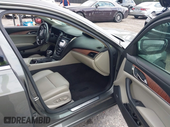 2016 Cadillac CTS Luxury Collection RWD with VIN 1G6AR5SXXG0108544, listed as a IAAI auction lot 41985630 with 86,014 mi miles and . Bid and sale history available at DreamBid. Image 5.