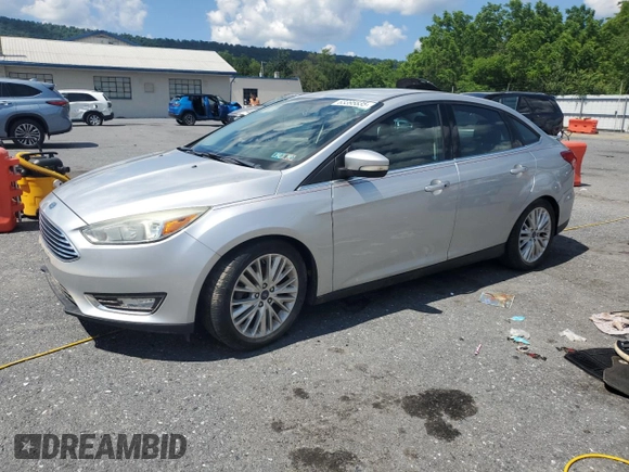 2015 Ford Focus Titanium with VIN 1FADP3J27FL267339, listed as a Copart auction lot 63395835 with 73,372 mi miles and Salvage title. Bid and sale history available at DreamBid. Image 1.