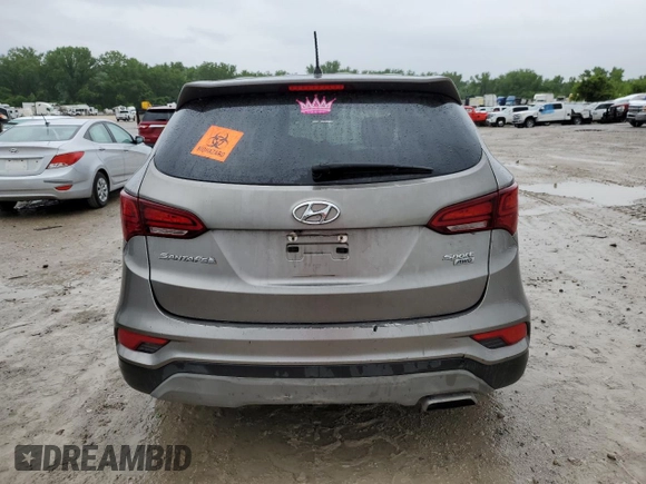 2018 Hyundai Santa Fe 2.4L z VIN 5NMZTDLB0JH087449, wystawiony jako Copart lot #58903105 z przebiegiem 114 037 mil mil oraz Szkoda całkowita • Salvage title. Historia ofert i sprzedaży dostępna na DreamBid. Obrazek 6.
