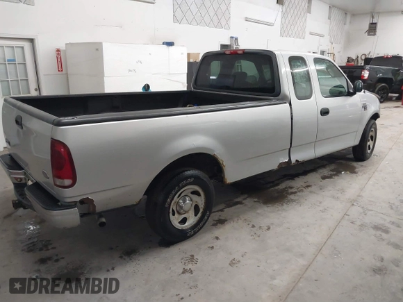 2002 Ford F-150 XL with VIN 1FTRX17W52NB23883, listed as a IAAI auction lot 41721680 with 144,115 mi miles. Bid and sale history available at carsss.com. Image 4.