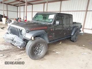 2022 Jeep Gladiator Mojave z VIN 1C6JJTEG8NL182360, wystawiony jako IAAI lot #42194516 z przebiegiem 67 658 mil mil oraz . Historia ofert i sprzedaży dostępna na DreamBid. Obrazek 2.