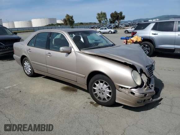 2001 Mercedes-Benz E-Class with VIN WDBJF65J11B357893, listed as a Copart auction lot 48573305 with 141,044 mi miles and Salvage Title. Bid and sale history available at carsss.com. Image 4.