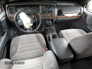 1997 Jeep Grand Cherokee Laredo with VIN 1J4GZ58S3VC739922, listed as a Copart auction lot 55667885 with 209,075 mi miles and Salvage title. Bid and sale history available at DreamBid. Image 8.