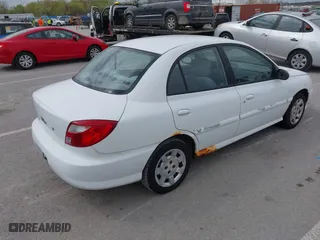 2002 Kia Rio with VIN KNADC123926185376, listed as a IAAI auction lot 42027348 with 84,893 mi miles. Bid and sale history available at carsss.com. Image 4.