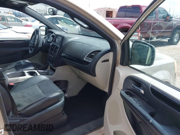 2014 Dodge Grand Caravan SXT with VIN 2C4RDGCG6ER466459, listed as a IAAI auction lot 41820907 with 105,404 mi miles and . Bid and sale history available at DreamBid. Image 5.