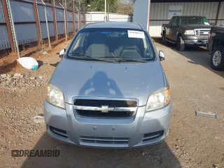 2009 Chevrolet Aveo 1LT z VIN KL1TD56E49B372791, wystawiony jako IAAI lot #41890124 z przebiegiem 118 648 mil mil oraz . Historia ofert i sprzedaży dostępna na DreamBid. Obrazek 12.