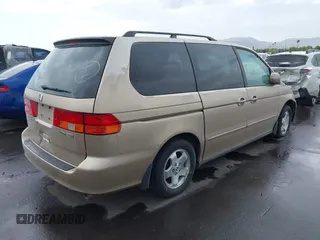 1999 Honda Odyssey EX z VIN 2HKRL1867XH535563, wystawiony jako IAAI lot #42188335 z przebiegiem 198 322 mil mil oraz . Historia ofert i sprzedaży dostępna na DreamBid. Obrazek 4.