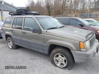 1996 Jeep Grand Cherokee with VIN 1J4EZ58S1TC112995, listed as a IAAI auction lot 41706966 with 356,727 mi miles and . Bid and sale history available at DreamBid. Image 6.