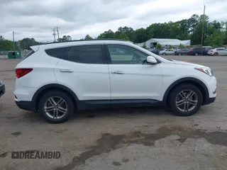 2018 Hyundai Santa Fe 2.4L z VIN 5XYZUDLB1JG543837, wystawiony jako IAAI lot #42235471 z przebiegiem 157 909 mil mil oraz . Historia ofert i sprzedaży dostępna na DreamBid. Obrazek 13.