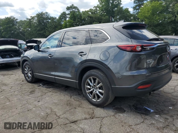 2019 Mazda CX-9 Touring with VIN JM3TCACY6K0334121, listed as a Copart auction lot 64901735 with 112,328 mi miles and Salvage title. Bid and sale history available at DreamBid. Image 2.