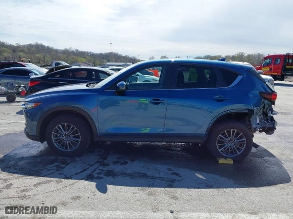 2019 Mazda CX-5 Touring with VIN JM3KFACM9K0686951, listed as a IAAI auction lot 41870797 with 66,303 mi miles. Bid and sale history available at carsss.com. Image 15.