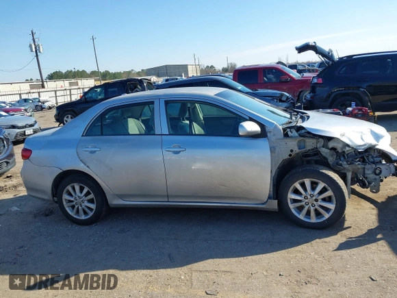 2009 Toyota Corolla with VIN JTDBL40E999021621, listed as a IAAI auction lot 41636462 with 123,650 mi miles. Bid and sale history available at carsss.com. Image 13.