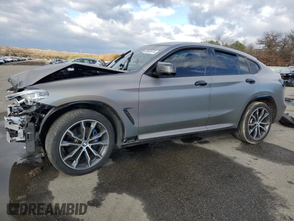 2021 BMW X4 M40i z VIN 5UX2V5C08M9F52562, wystawiony jako Copart lot #83665674 z przebiegiem Nie podano mil oraz Szkoda całkowita • Salvage title. Historia ofert i sprzedaży dostępna na DreamBid. Obrazek 1.