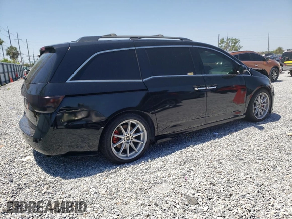2014 Honda Odyssey Touring with VIN 5FNRL5H97EB016624, listed as a Copart auction lot 53444645 with 244,126 mi miles and Salvage Title. Bid and sale history available at DreamBid. Image 3.