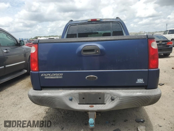 2005 Ford Explorer Sport Trac XLS with VIN 1FMDU67K95UB80915, listed as a Copart auction lot 54672085 with 182,683 mi miles and Salvage title. Bid and sale history available at DreamBid. Image 6.