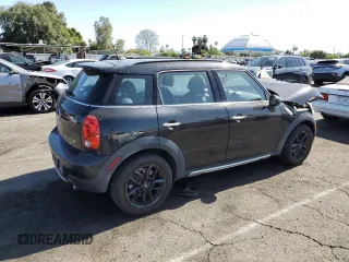 2016 MINI Countryman with VIN WMWZB3C58GWR47074, listed as a Copart auction lot 57174885 with 83,062 mi miles and Salvage title. Bid and sale history available at DreamBid. Image 3.