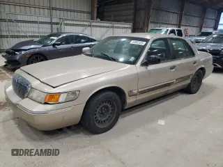 2000 Mercury Grand Marquis GS z VIN 2MEFM74WXYX739426, wystawiony jako Copart lot #54002325 z przebiegiem 156 437 mil mil oraz Czysty tytuł • Clean title. Historia ofert i sprzedaży dostępna na DreamBid. Obrazek 1.
