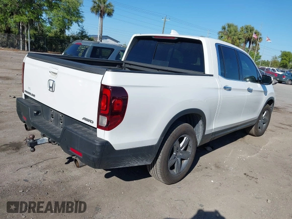 2021 Honda Ridgeline RTL-E with VIN 5FPYK3F7XMB011525, listed as a IAAI auction lot 41774012 with 98,031 mi miles and . Bid and sale history available at DreamBid. Image 4.