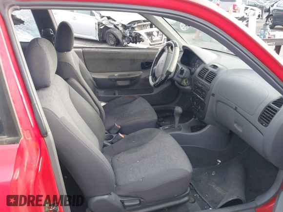 2003 Hyundai Accent GL z VIN KMHCG35C23U238969, wystawiony jako IAAI lot #41462884 z przebiegiem 156 682 mil mil oraz . Historia ofert i sprzedaży dostępna na DreamBid. Obrazek 5.