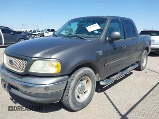 2003 Ford F-150 XLT with VIN 1FTRW07L63KA65904, listed as a IAAI auction lot 41983556 with 166,086 mi miles. Bid and sale history available at carsss.com. Image 2.