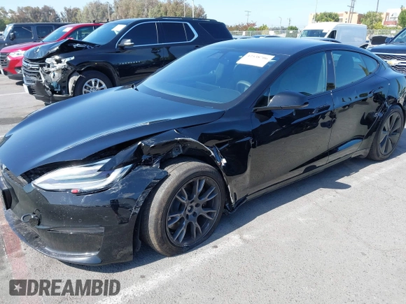 2022 Tesla Model S with VIN 5YJSA1E5XNF467435, listed as a IAAI auction lot 42538706 with 26,504 mi miles and . Bid and sale history available at DreamBid. Image 6.