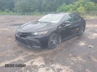 2023 Toyota Camry SE with VIN 4T1G11AKXPU827360, listed as a IAAI auction lot 42217356 with 57,497 mi miles and . Bid and sale history available at DreamBid. Image 17.