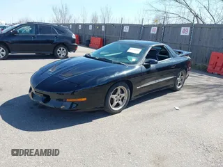 1997 Pontiac Firebird Trans Am with VIN 2G2FV22P7V2215905, listed as a IAAI auction lot 41764996 with 112,368 mi miles. Bid and sale history available at carsss.com. Image 2.