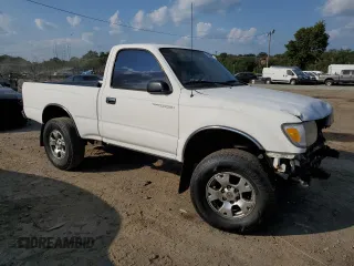 1999 Toyota Tacoma with VIN 4TAPM62N8XZ457624, listed as a Copart auction lot 71565904 with 133,851 mi miles and Salvage Title. Bid and sale history available at DreamBid. Image 4.