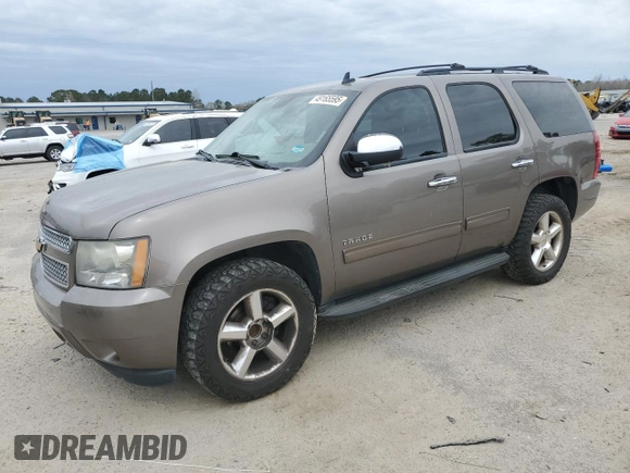 2011 Chevrolet Tahoe LS with VIN 1GNSCAE09BR138852, listed as a Copart auction lot 49165595 with 207,548 mi miles and Salvage title. Bid and sale history available at DreamBid. Image 1.