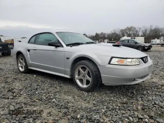 2003 Ford Mustang GT Deluxe with VIN 1FAFP42X33F380899, listed as a Copart auction lot 42158555 with 142,086 mi miles and Salvage Title. Bid and sale history available at carsss.com. Image 4.