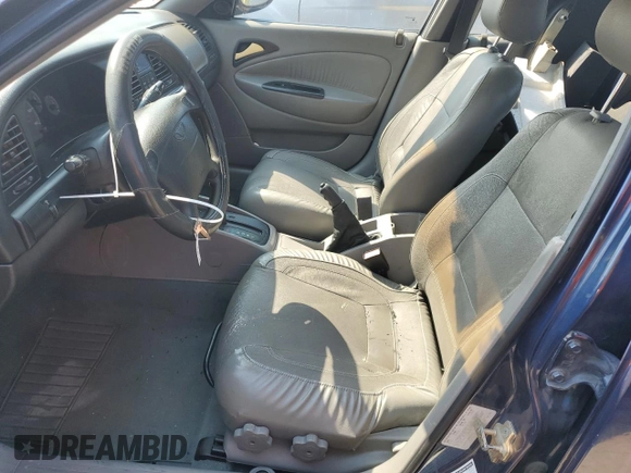 2001 Daewoo Nubira CDX z VIN KLAJB52Z31K647237, wystawiony jako Copart lot #69299834 z przebiegiem 51 513 mil mil oraz Szkody całkowita. Historia ofert i sprzedaży dostępna na DreamBid. Obrazek 7.
