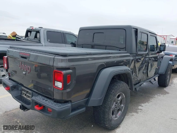 2020 Jeep Gladiator Rubicon with VIN 1C6JJTBG8LL135573, listed as a IAAI auction lot 41585896 with 79,070 mi miles. Bid and sale history available at carsss.com. Image 4.