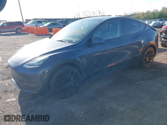 2021 Tesla Model Y Long Range with VIN 5YJYGAEE1MF149887, listed as a IAAI auction lot 42032104 with 54,932 mi miles. Bid and sale history available at carsss.com. Image 2.