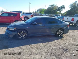 2019 Volkswagen Jetta GLI S z VIN 3VW6T7BU5KM169132, wystawiony jako IAAI lot #41599605 z przebiegiem 59 744 mil mil oraz . Historia ofert i sprzedaży dostępna na DreamBid. Obrazek 14.