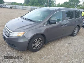 2012 Honda Odyssey EX-L with VIN 5FNRL5H60CB054277, listed as a IAAI auction lot 42459861 with 205,722 mi miles and . Bid and sale history available at DreamBid. Image 2.