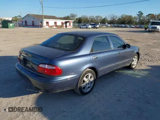 2002 Mazda 626 LX with VIN 1YVGF22D925287959, listed as a IAAI auction lot 41610932 with 122,333 mi miles. Bid and sale history available at carsss.com. Image 4.