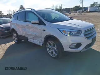 2019 Ford Escape Titanium with VIN 1FMCU9J91KUB21842, listed as a IAAI auction lot 41632210 with 104,900 mi miles. Bid and sale history available at carsss.com. Image 1.