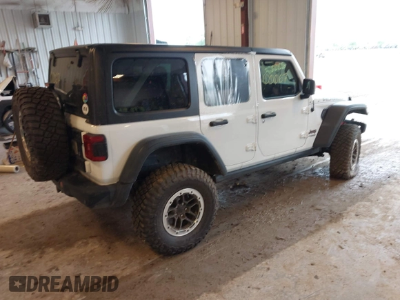 2022 Jeep Wrangler Unlimited Rubicon with VIN 1C4JJXFM0NW154202, listed as a IAAI auction lot 42400067 with 60,486 mi miles and . Bid and sale history available at DreamBid. Image 4.