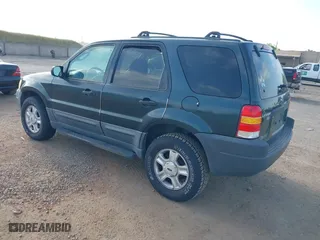 2003 Ford Escape XLT Popular 2 with VIN 1FMYU93113KE18944, listed as a IAAI auction lot 42056372 with 244,942 mi miles. Bid and sale history available at carsss.com. Image 3.