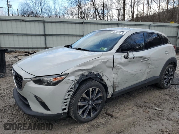 2019 Mazda CX-3 Touring with VIN JM1DKFC78K0405131, listed as a Copart auction lot 87065614 with 91,091 mi miles and Salvage Title. Bid and sale history available at carsss.com. Image 1.