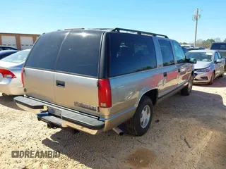 1999 Chevrolet Suburban with VIN 3GNEC16R1XG198724, listed as a IAAI auction lot 41812563 with 207,922 mi miles. Bid and sale history available at carsss.com. Image 4.